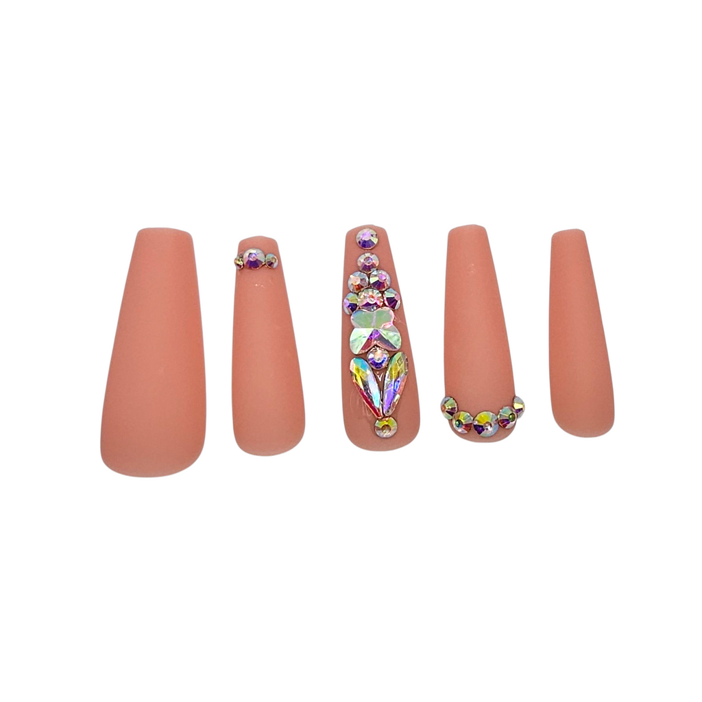 Side view of Birthday Behavior press-on nails — luxury matte rose coffin nails with sparkle detail.