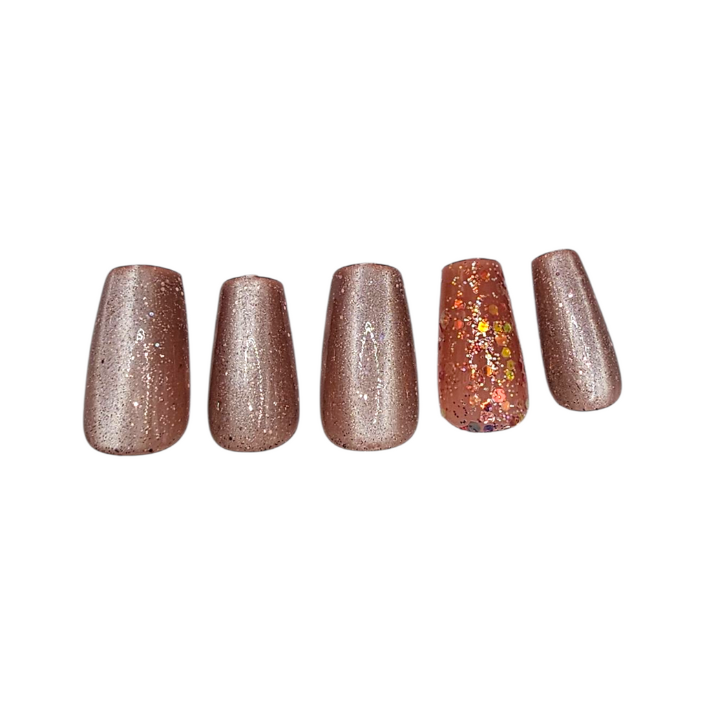 Close-up of Caviar Nights press-ons – bronze shimmer with confetti accent nail – Rodeo & Wilshire Beauty