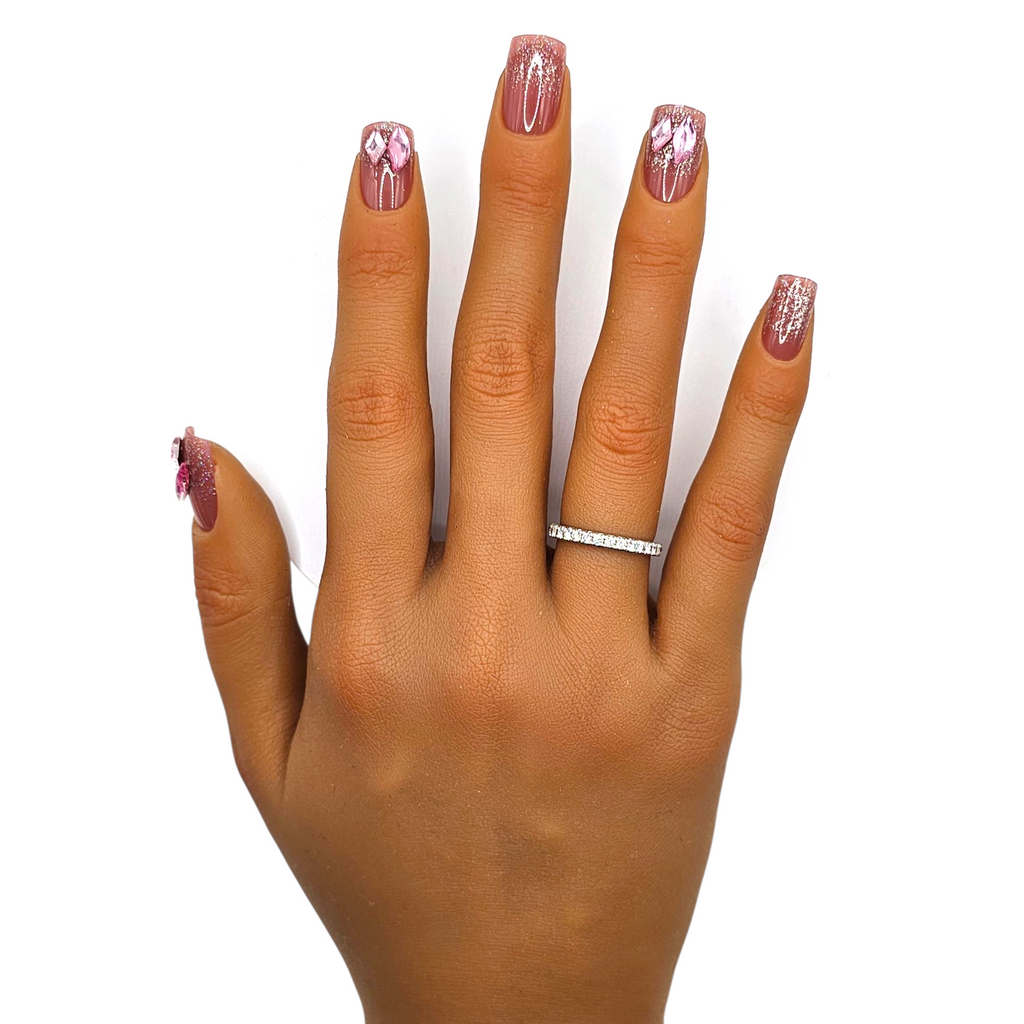 Flirtini press-on nails front view — short square mauve pink nails with rhinestone & glitter accent.