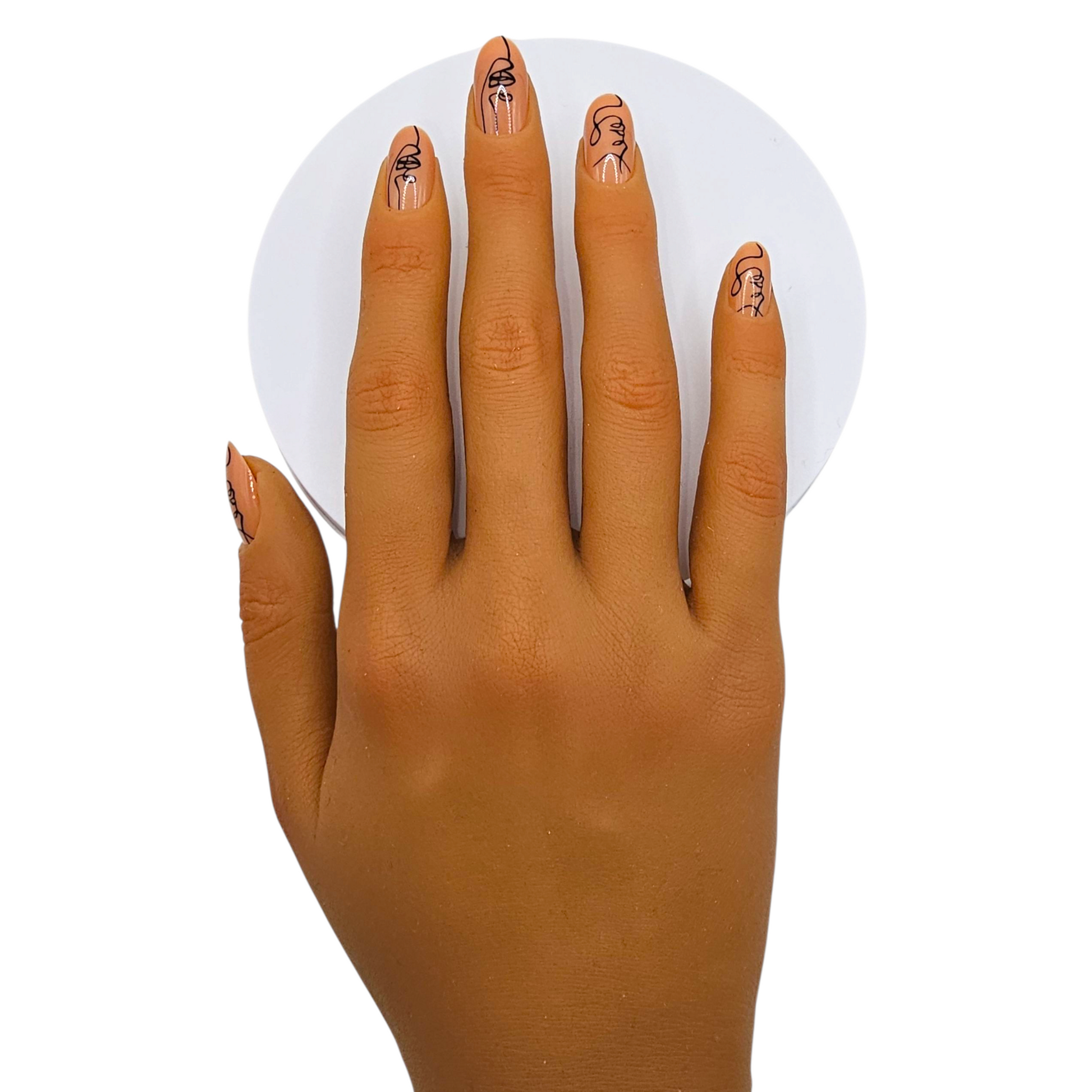 Picasso Baby press-on nails front view — abstract line art face almond nails.