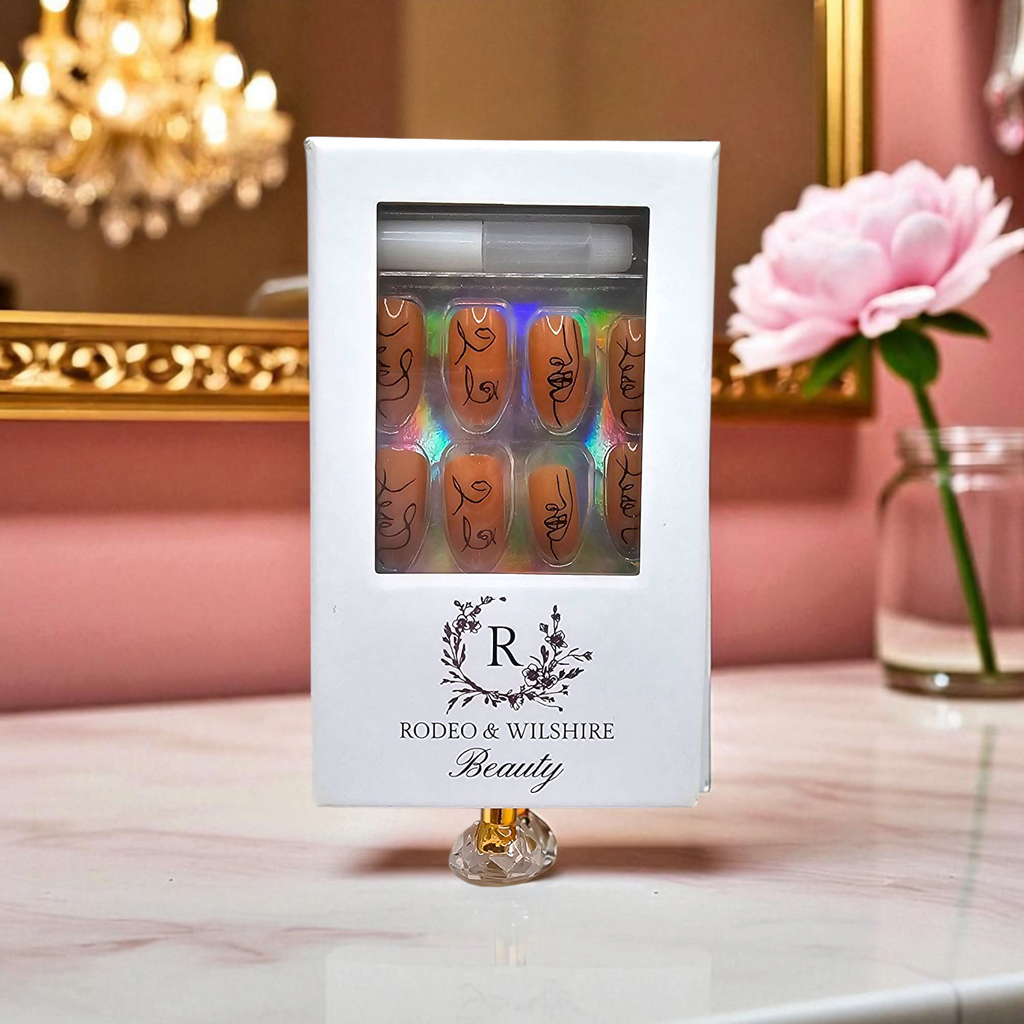 Picasso Baby press-on nails styled — modern abstract face design for chic nail art lovers