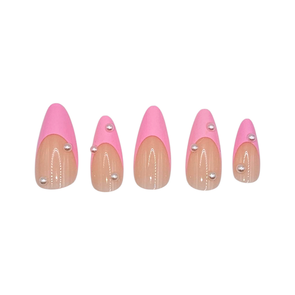 Close-up of Pilates Princess press-ons – nude base with pink tips and pearls – Rodeo & Wilshire Beauty