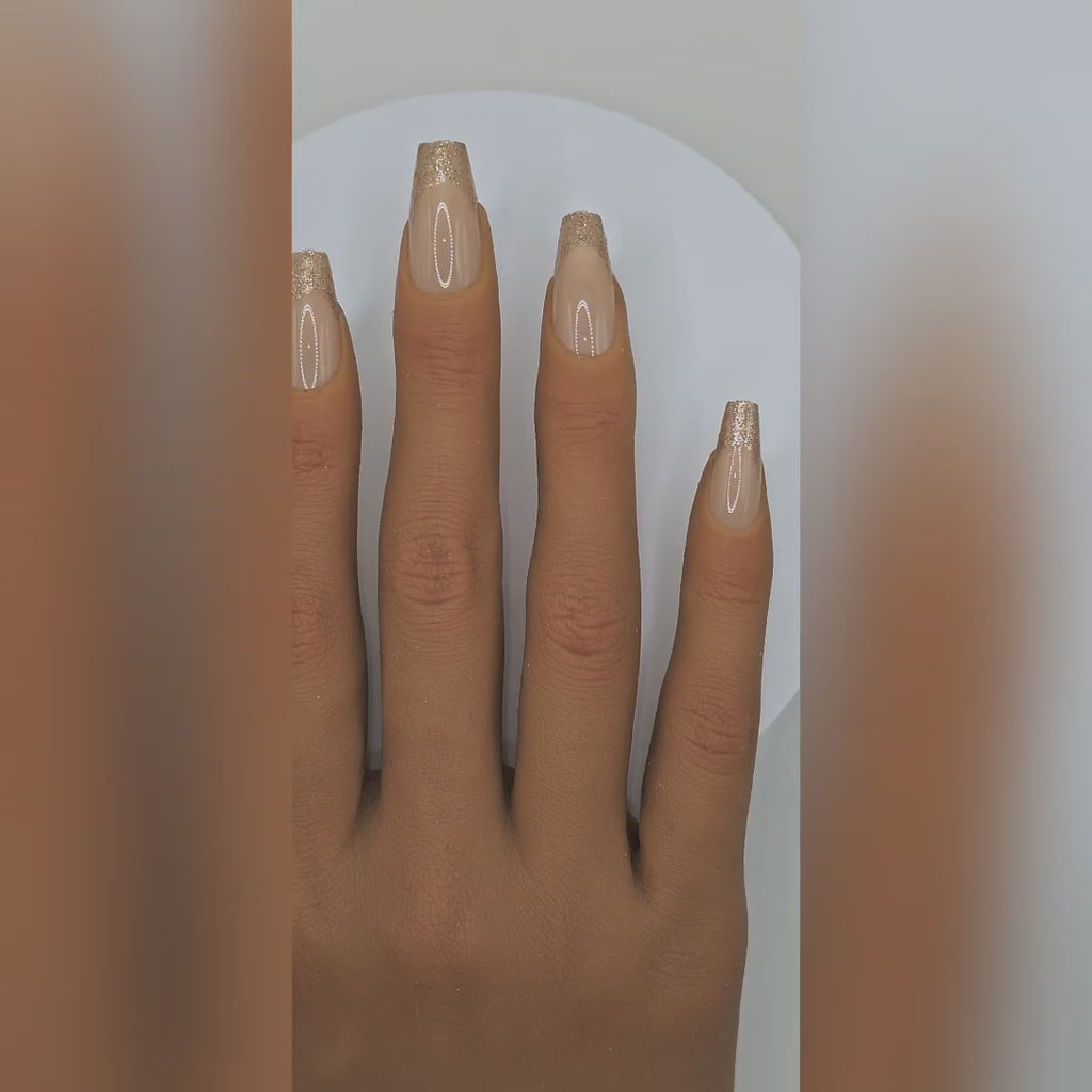Application video showing Honey Dip nude & gold sparkle French tip press-on nails – Date Night styling – Rodeo & Wilshire Beauty