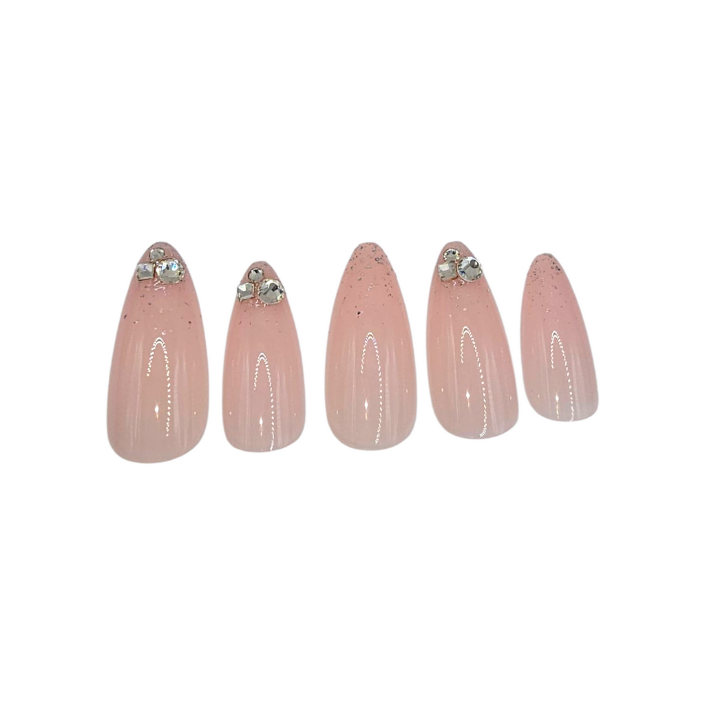 Close-up of Quiet Luxury press-ons – sheer soft pink with delicate crystals – Rodeo & Wilshire Beauty